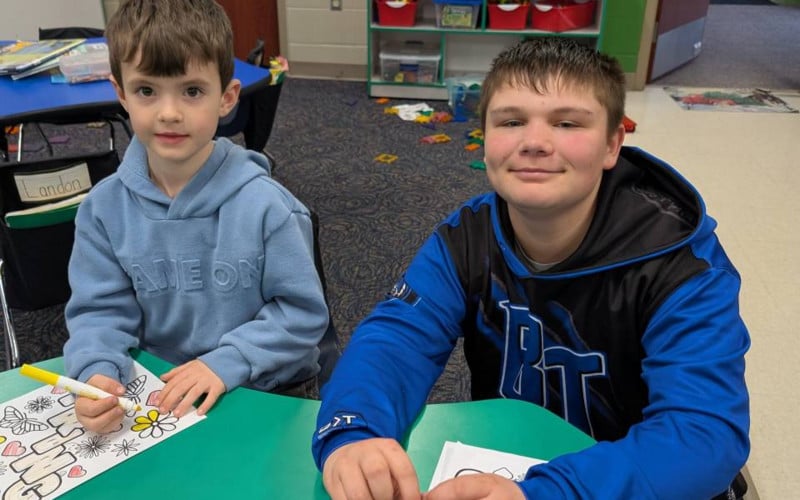 two boys coloring